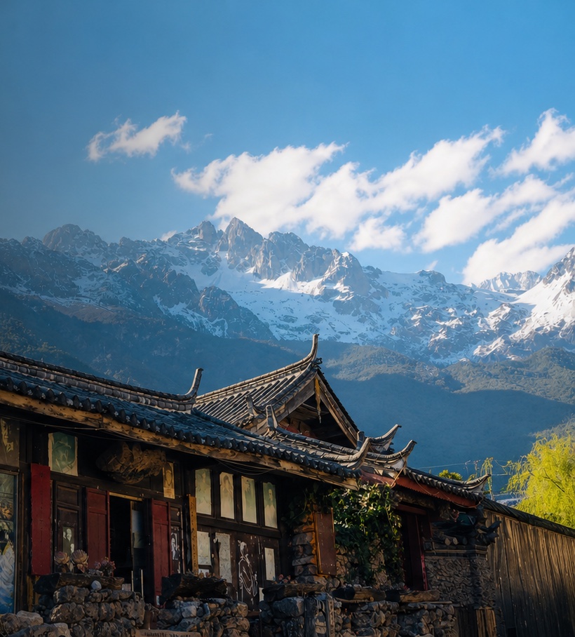 Traditional Lijiang rooftops beneath Jade Dragon Snow Mountain